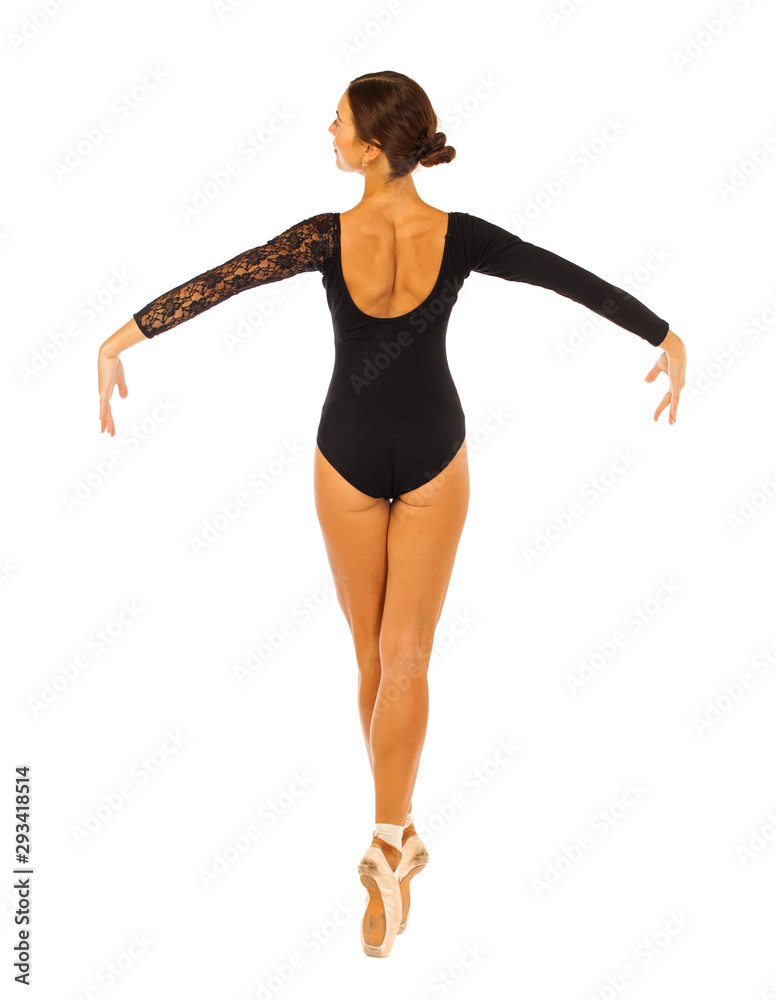 Portrait of a young beautiful ballerina in black ballet suit, isolated on white background Portrait of a young beautiful ballerina in black ballet suit, isolated on white background