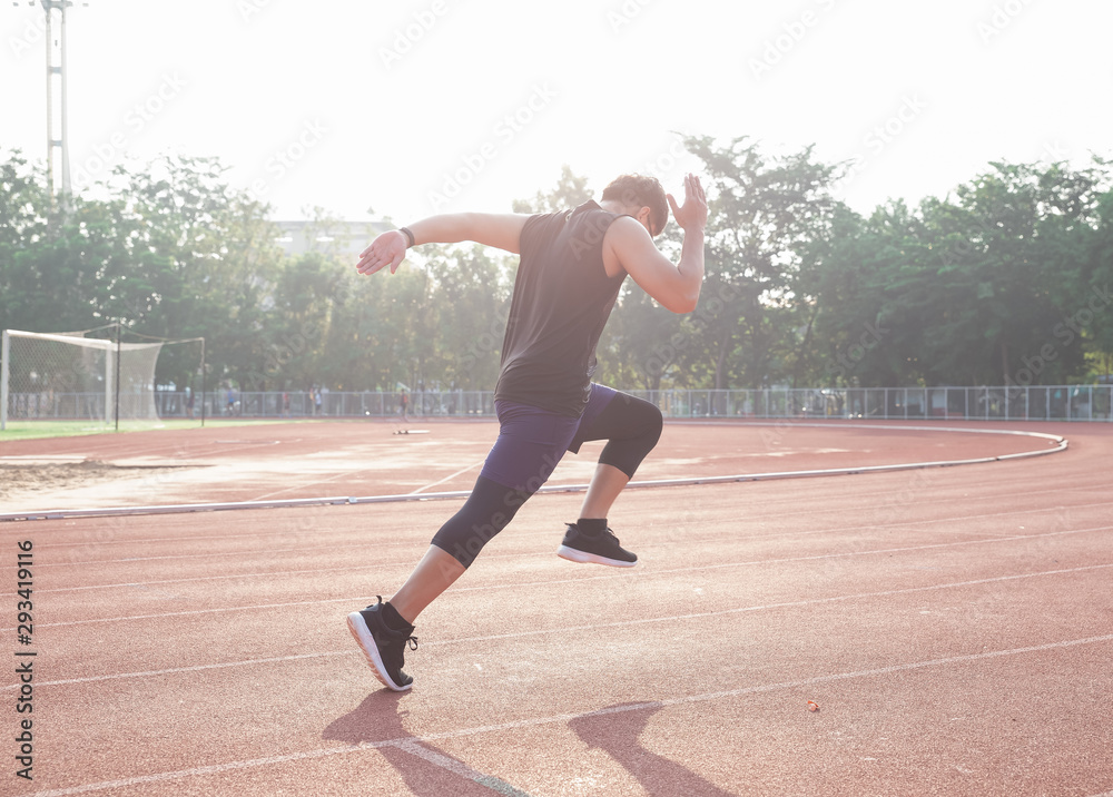 Sprinter leaving starting blocks on the running track. Explosive start. Sprinter leaving starting blocks on the running track. Explosive start.