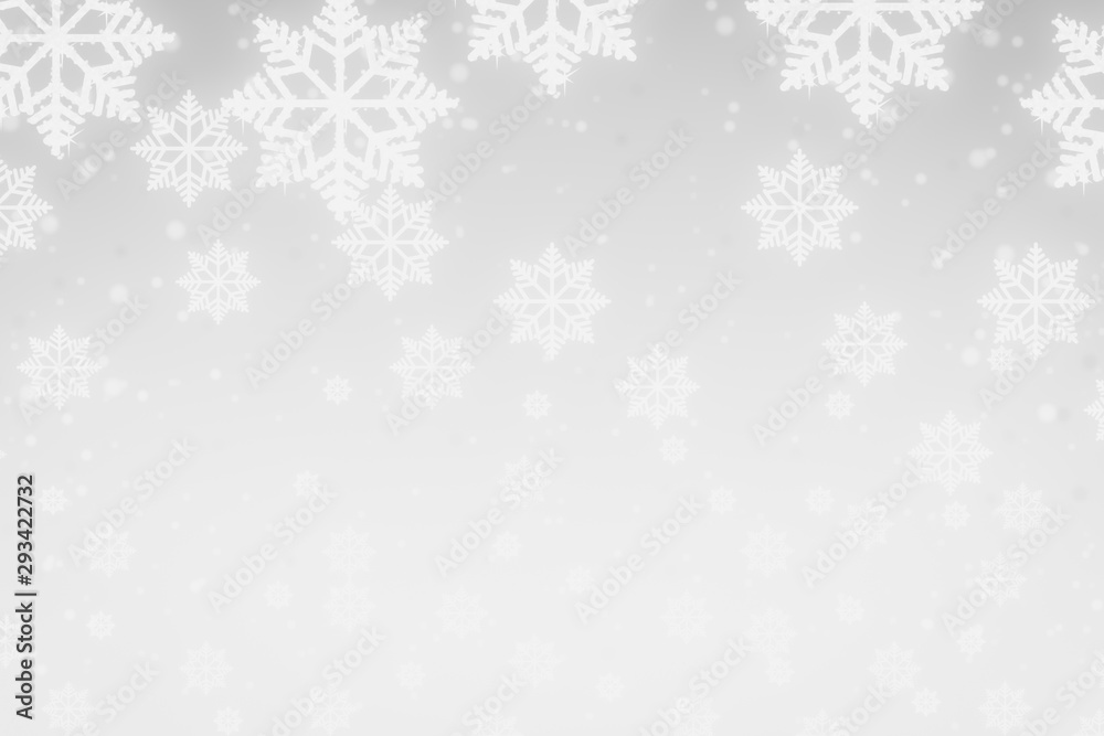 Snowflakes and snowfall on a cold blue winter background christmas