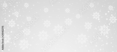 white Snowflakes and snowfall on a cold silver winter christmas background
