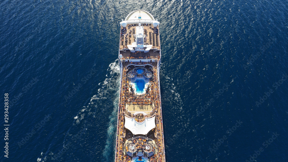 Aerial photo of large cruise liner ship cruising deep blue open ocean sea