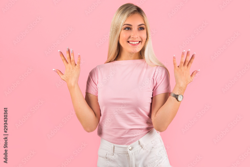 beautiful young woman on pink background with hand gesture