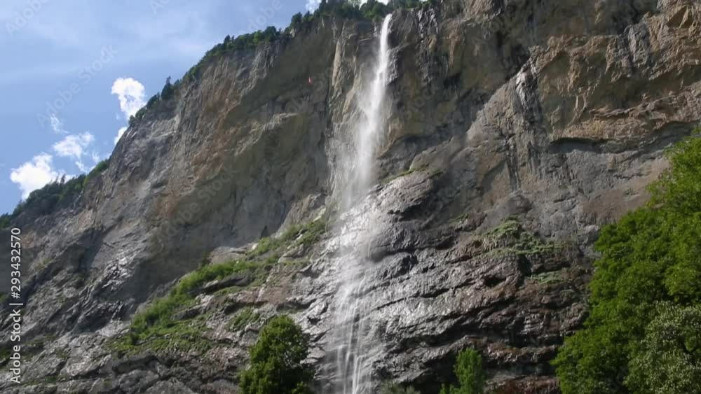 Mountain waterfall rapid waters falling from the cliff in Lauterbrunnen Mountain waterfall rapid waters falling from the cliff in Lauterbrunnen