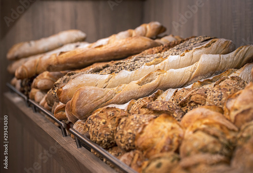 Variety of bread on the shelf. Freshly baked loaves photo