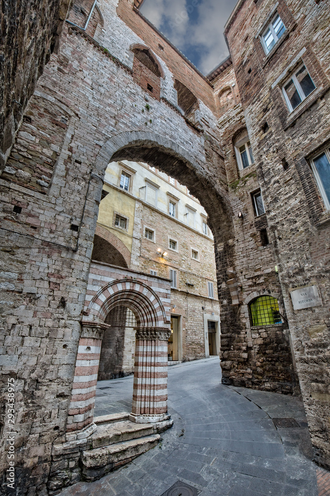 Ancient monumental architecture in Perugia.Narrow streets, arches and old buildings in the historic center of beautiful town of Perugia, in Umbria, Italy