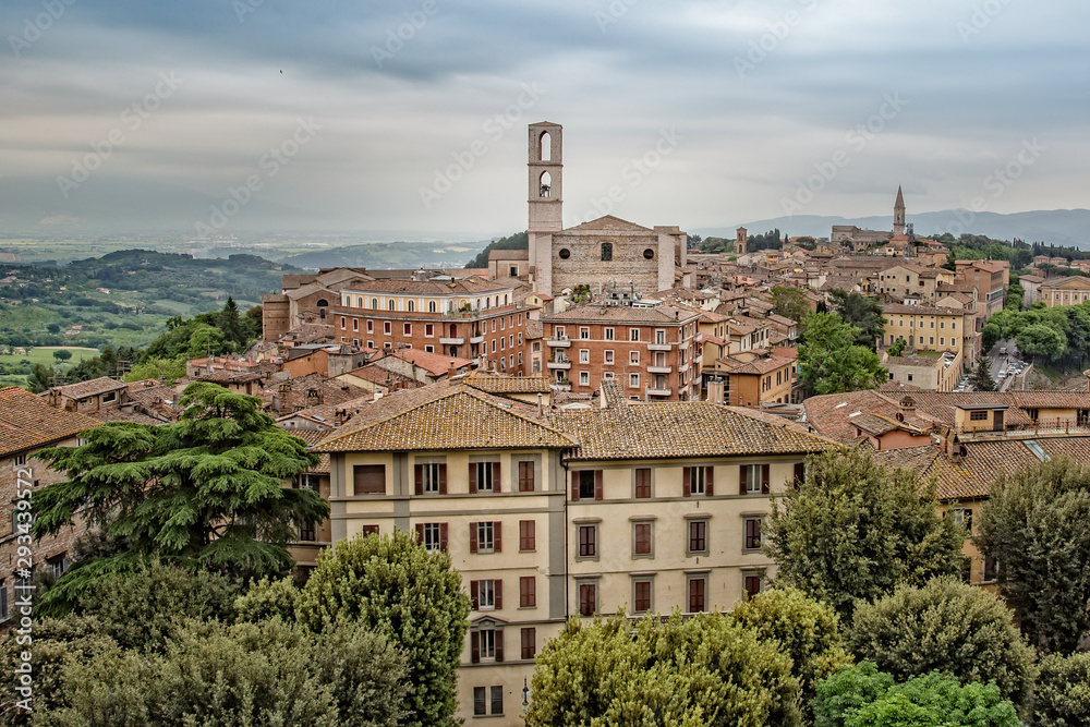 Perugia is a lively medieval walled hill town.View of the Basilica of San Domenico with medieval houses in Perugia historic quarter, Umbria, Italy
