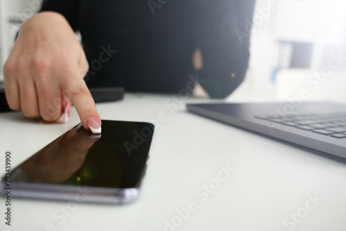 Female arm hold phone and silver pen at workplace closeup. Read news mania send sms chat addict use electronic bank modern lifestyle job plan colleague share blog tweet web application search