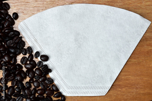 roasted coffee bean and paper colander photo