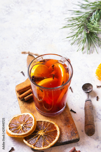 Christmas drink, mulled wine with orange, cinnamon and cloves on white background