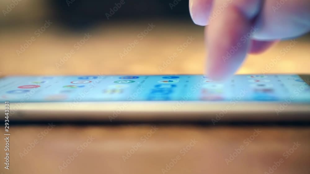 modern technologies. Close-up shot of a finger that clicks on the glass screen of a smartphone. shallow depth of field modern technologies. Close-up shot of a finger that clicks on the glass screen of a smartphone. shallow depth of field