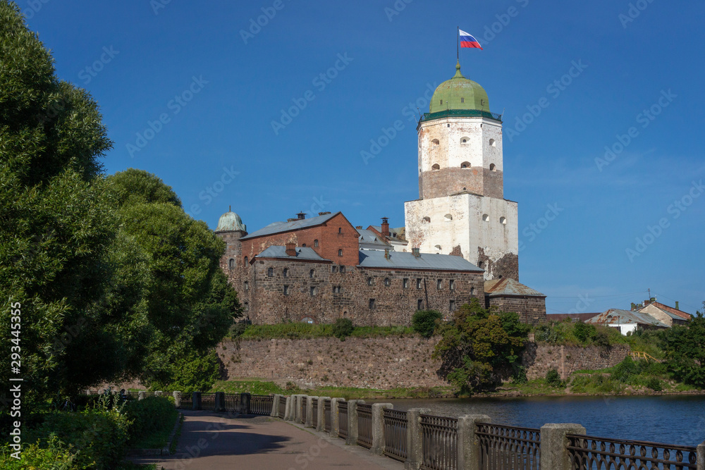 Vyborg castle in summer season. View from bay embankment. Russia..