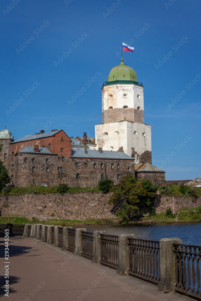Summer view of old Vyborg castle, Russia.  Bay embankment..