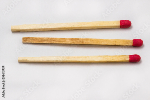 three unlit matchstick in a row