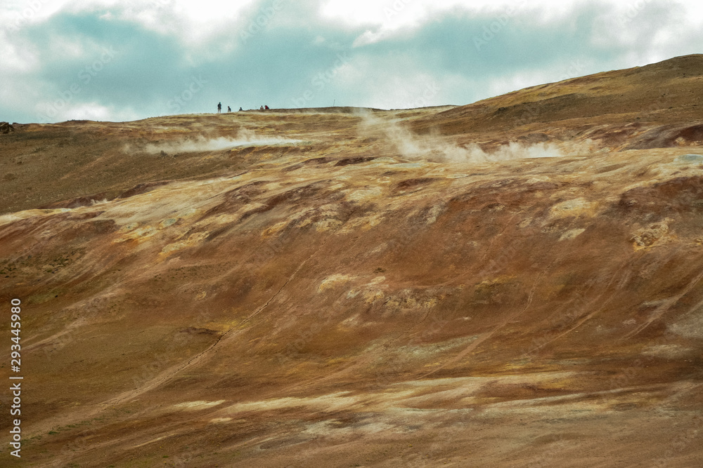 Leirhnjukur clay hill in Iceland with people on top, overcast day in summer , film effect with grain
