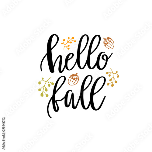 Hello fall hand lettering phrase on orange watercolor maple leaf background
