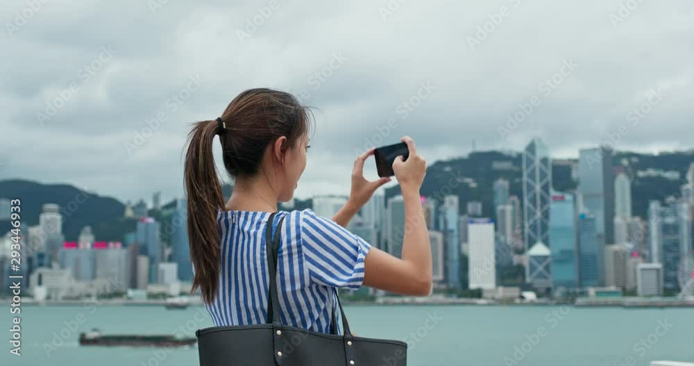 Woman use of mobile phone to take photo in Hong Kong city Stock Video ...