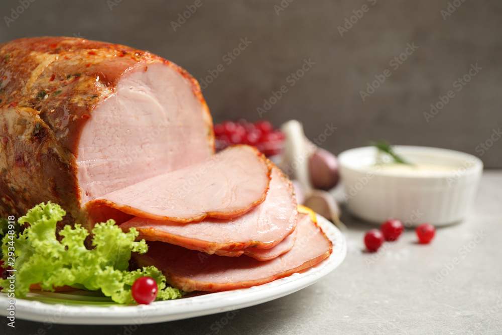Delicious ham served with garnish on grey table, closeup Delicious ham served with garnish on grey table, closeup