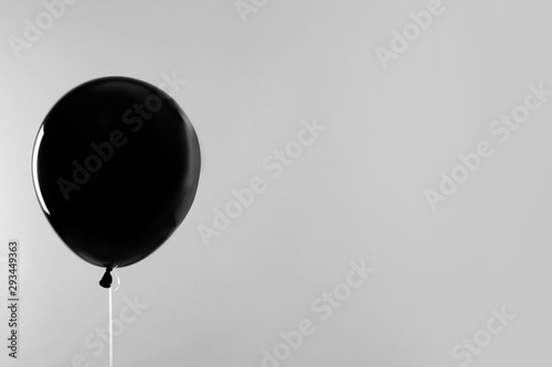 Quadro su tela Black balloon for Halloween party on light grey background, space for text
