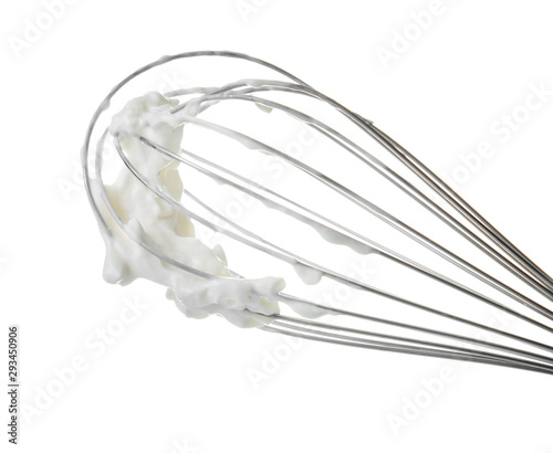 Whipped cream with whisk on white background