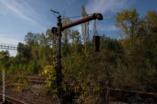 Rusty old bucket and pipe on abandoned railway line