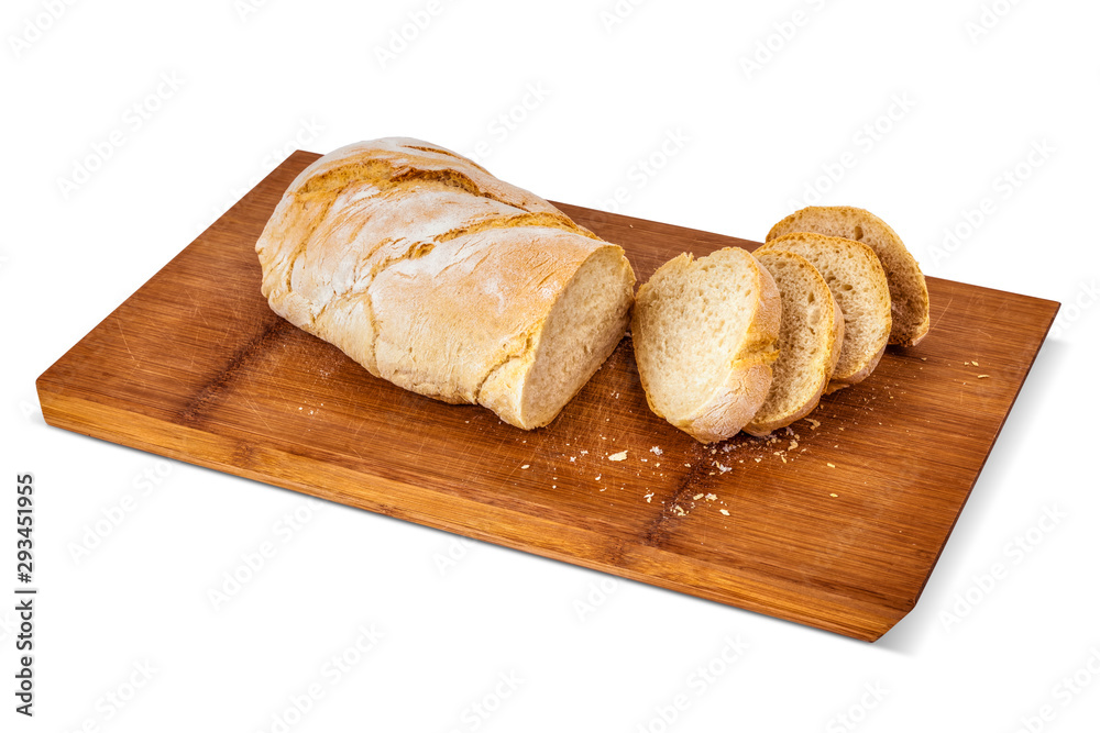 Chopped slices of bread on a bamboo cutting board.