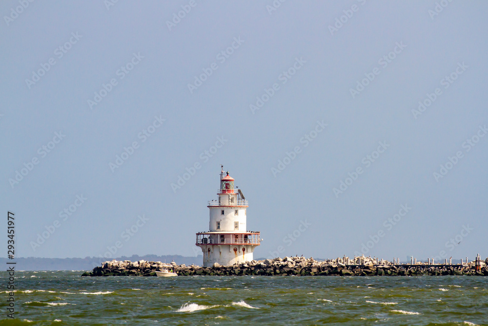 Brandywine Shoal Lighthouse with fishing boat