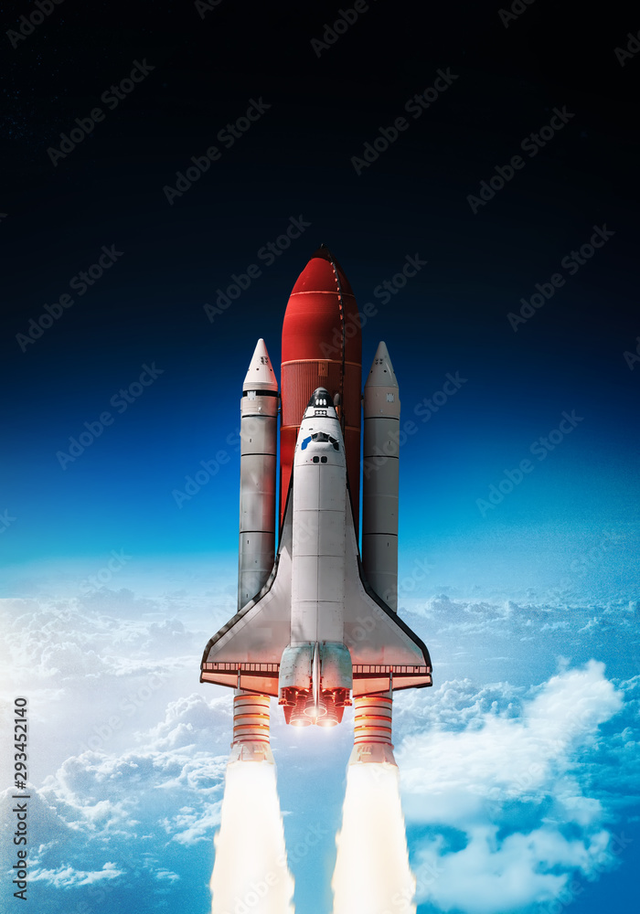 Fototapeta Space shuttle launch in outer space from Earth. Rocket on orbit of the planet. Border of blue sky with clouds and dark deep space. .Elements of this image furnished by NASA