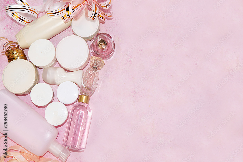 Sale, black friday, a set of creams for skin care and gift bags on a pink background, flat lay, top view. Concept of shopping and modern woman, place for text Sale, black friday, a set of creams for skin care and gift bags on a pink background, flat lay, top view. Concept of shopping and modern woman, place for text