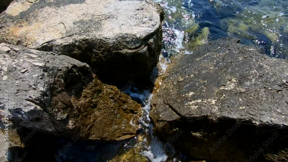 Slow motion bird eye descending sharp rock barrier shore Slow motion bird eye descending sharp rock barrier shore