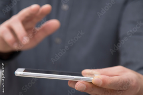 businessman hands with mobile touch phone, closeup view