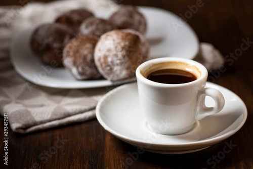 mini cheese donuts and a cup of coffee