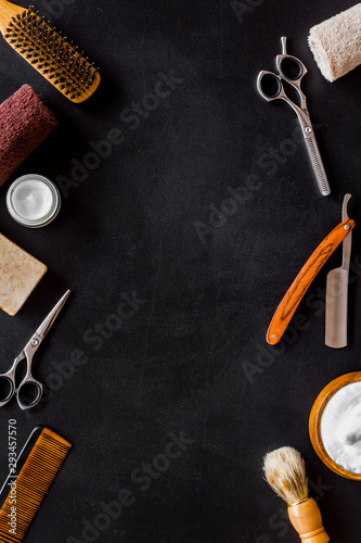Barbershop concept. Hairdressing tools on black background top view space for text