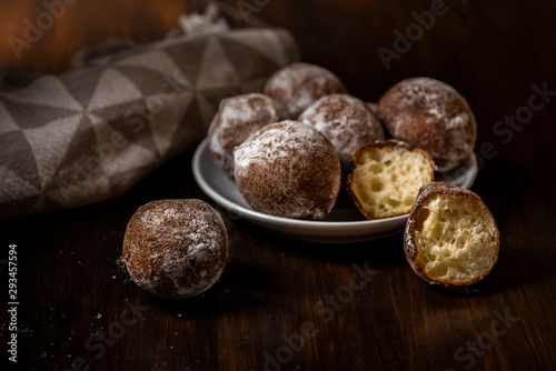 mini cheese donuts on a white plate