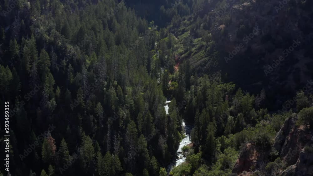 Aerial drone view of a beautiful river along a hiking trail on a warm sunny autumn day in Spanish Fork canyon in Utah Aerial drone view of a beautiful river along a hiking trail on a warm sunny autumn day in Spanish Fork canyon in Utah