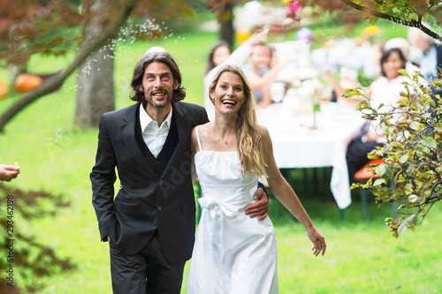 Bride and groom on a garden party photo