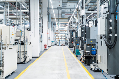 Footpath between industrial machinery in modern factory, Stuttgart, Germany photo