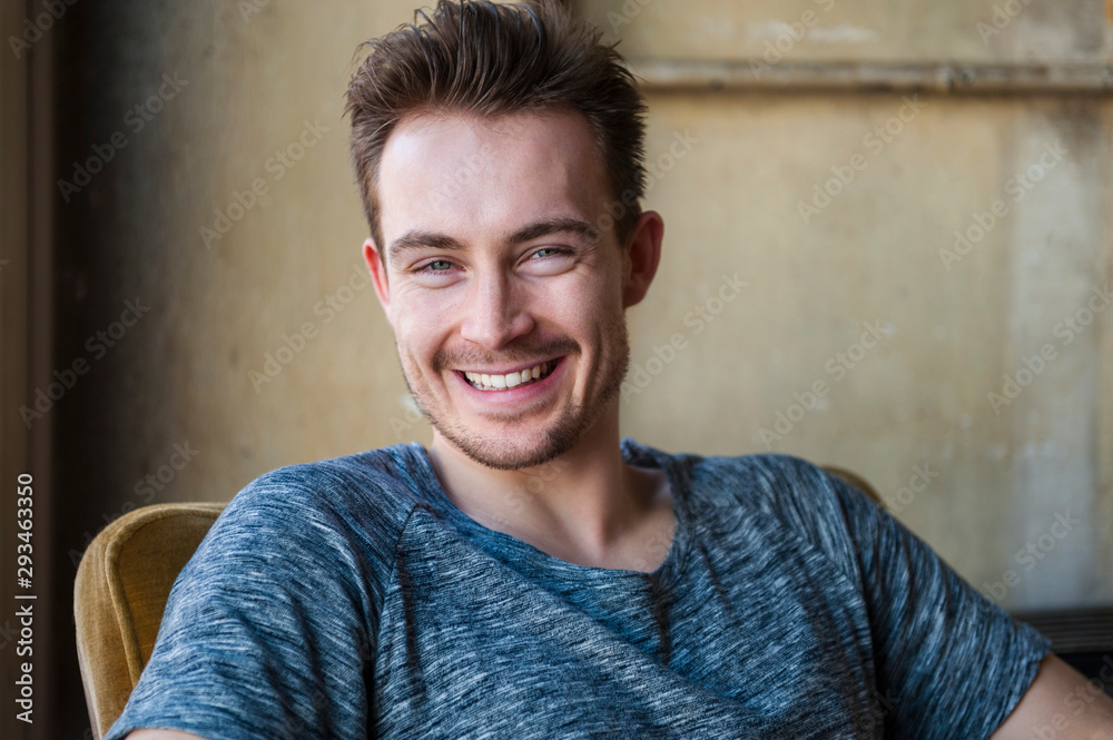 Portrait of happy young man with stubble Portrait of happy young man with stubble