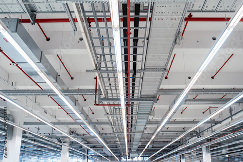 Illuminated ceiling of modern factory warehouse, Stuttgart, Germany photo