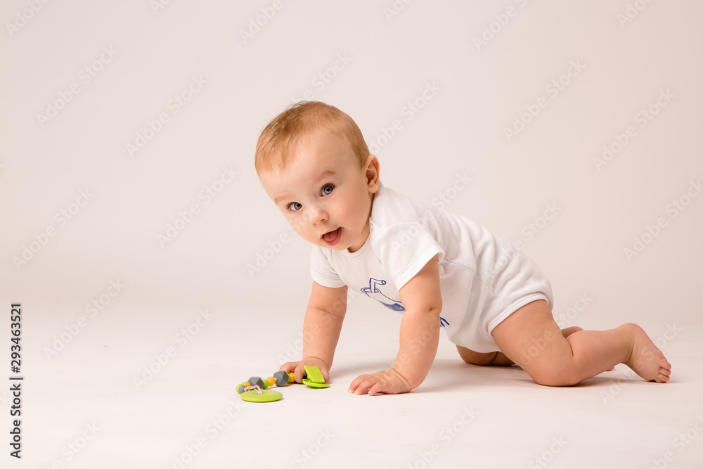 cute toddler boy on white background looking in frame, space for text, baby 8 months on white background cute toddler boy on white background looking in frame, space for text, baby 8 months on white background