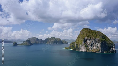 4K Aerial footage of breathtaking Pinagbuyutan Island. El Nido, Palawan, Philippines. Barcuit Archipelago, secluded island under cloudscape photo