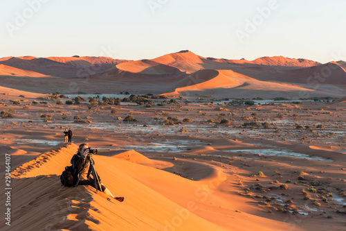 Namibia, Namib Desert, Namib Naukluft National Park, tourist photographing landscape photo