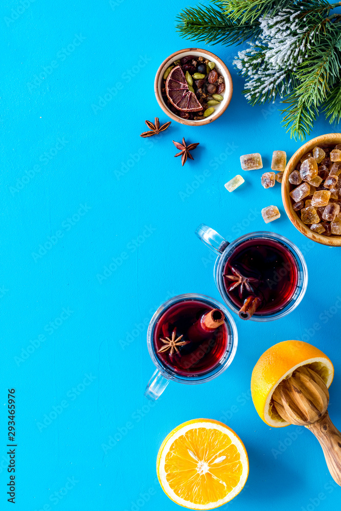 Romantic New Year with two glasses of mulled wine on blue background top view frame copy space Romantic New Year with two glasses of mulled wine on blue background top view frame copy space