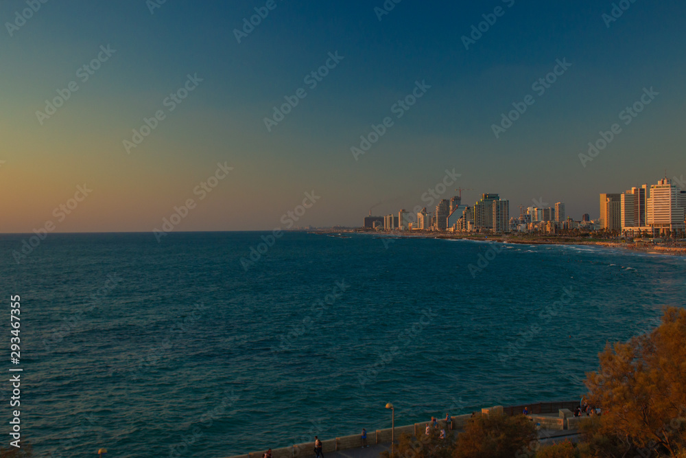 travel mobile photography with noise pollution of Tel Aviv Israeli capital city urban Mediterranean waterfront scenery landmark view in evening twilight time after sunset 