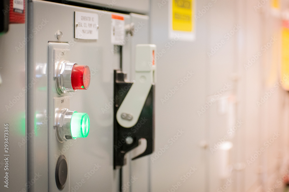 Industrial electrical supply board, status indicator button and switches.