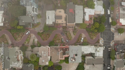 Aerial panoramic view of Lombard Street, an east–west street in San Francisco, CA. Famous for steep, one-block section with eight hairpin turns. Crookedest, steep hills, sharp curves, one-way road.