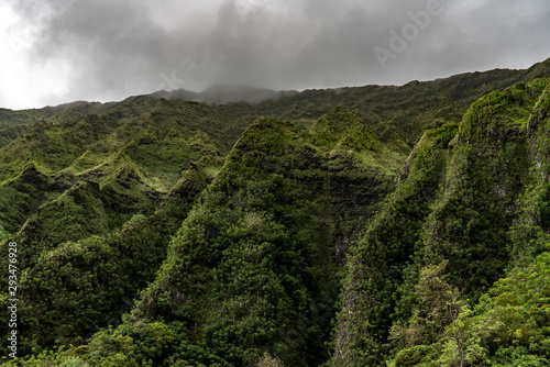 The Waianae Mountain Range in Oahu Hawaii during low clouds before a storm.
