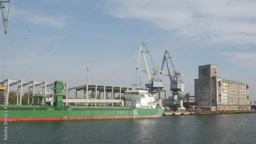 Sea Shipping Port with Cargo Cranes in Gdansk city at summer day Sea Shipping Port with Cargo Cranes in Gdansk city at summer day