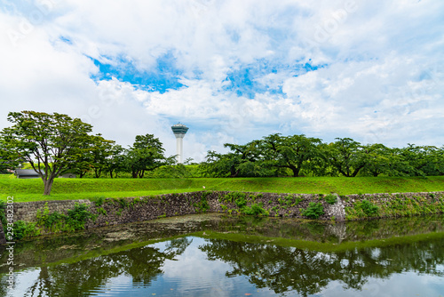 Goryokaku Tower in summer sunny day white clouds and bule sky. The tower observatory decks command the entire view of Goryokaku Park, the beautiful star shaped fort. Hakodate City, Hokkaido, Japan