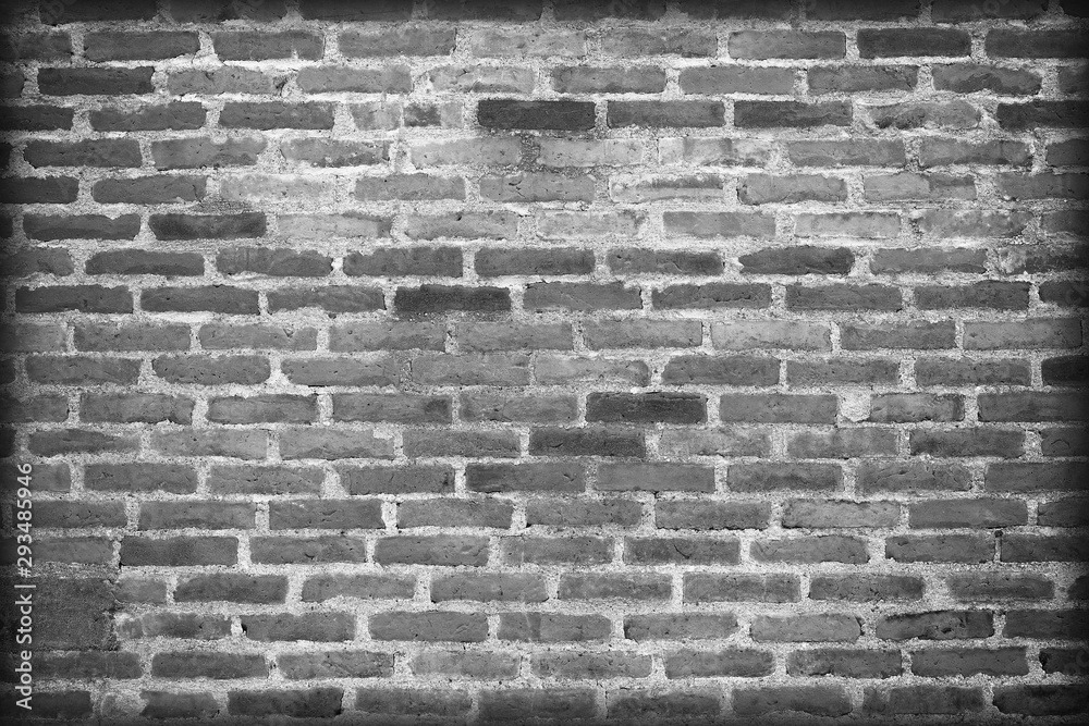Fototapeta premium old dark brick wall cracked concrete vintage background