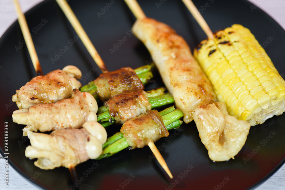 MALA Chinese BBQ - Grilled pork thai asian street food style slice pork with vegetable mushroom corn in skewer sticks grilled on plate with spicy powder chilli